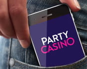 PartyCasino on a smartphone in a pocket
