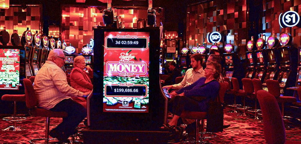 Gamblers playing slots in a land-based casino